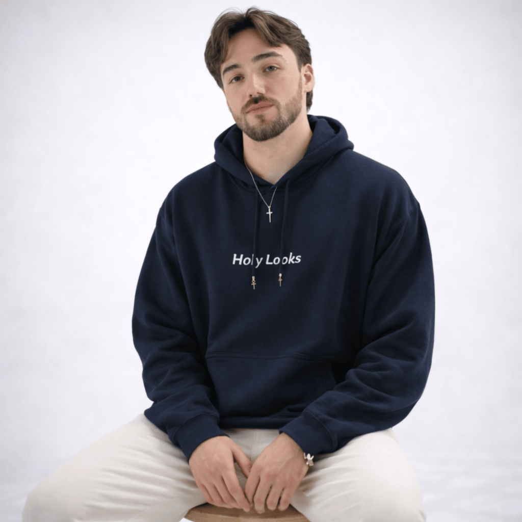 Man wearing a navy blue hoodie with 'Holy Looks' text on a white background